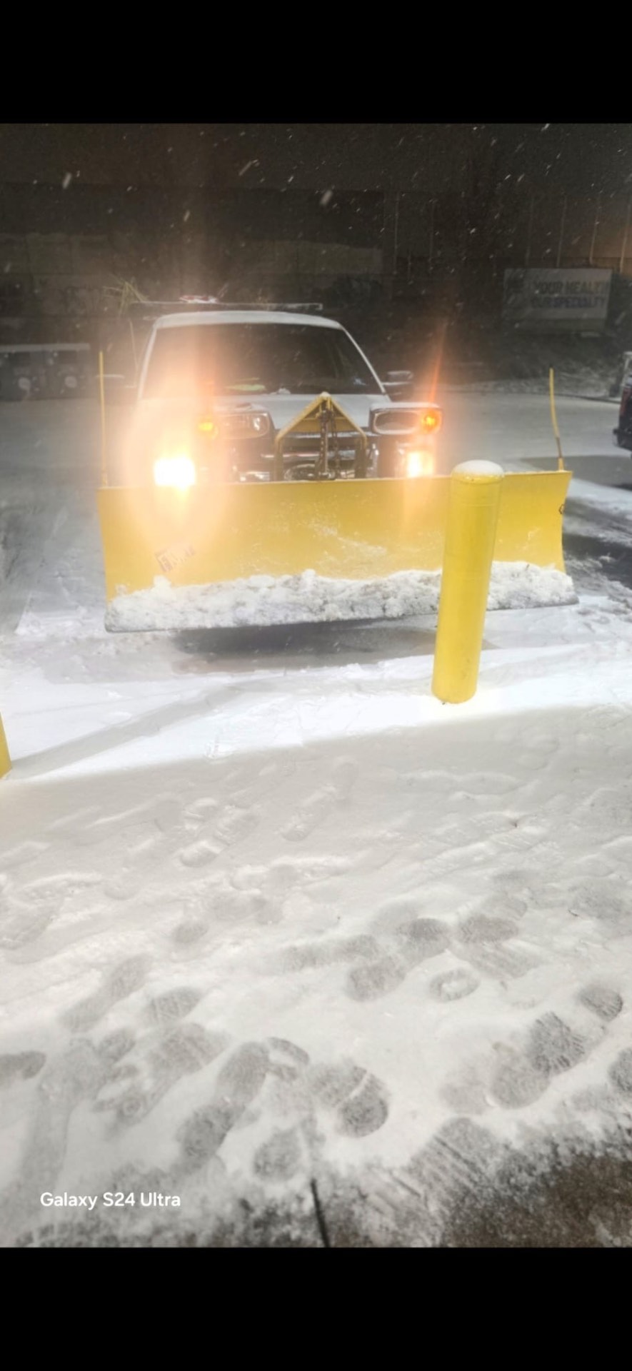 Snow plow truck clearing snow